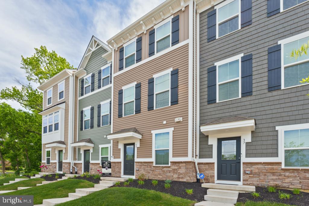39 Sidney Lane Stratford, NJ 08084 - Photo 2 of 21 front view of a brick house with a yard