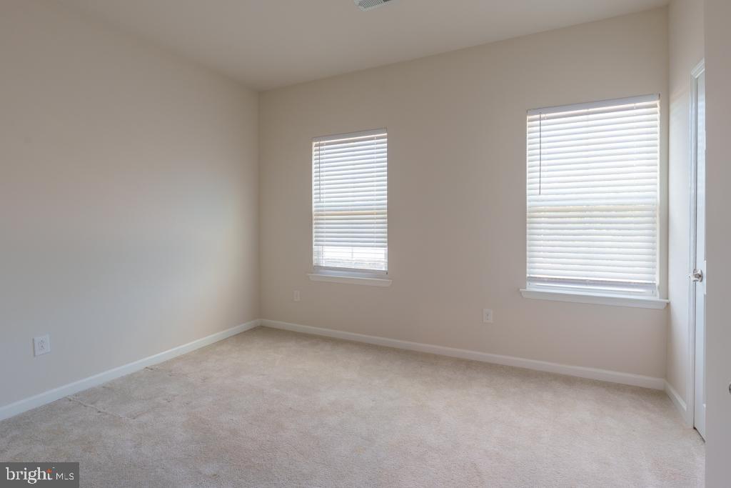 39 Sidney Lane Stratford, NJ 08084 - Photo 9 of 21 an empty room with windows