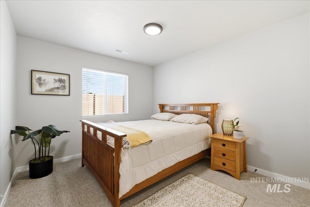 5392 South Memory Way Meridian, ID 83642 - Photo 16 of 39 Bedroom with baseboards and light carpet