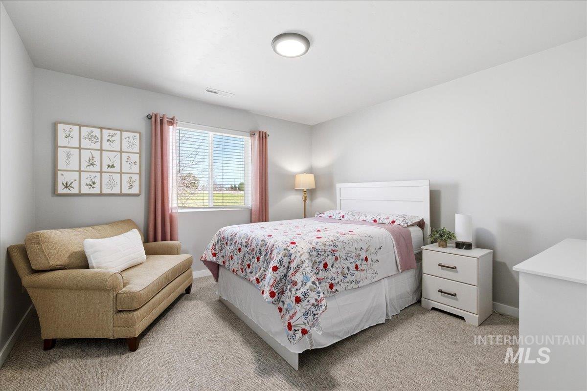 5392 South Memory Way Meridian, ID 83642 - Photo 28 of 39 Bedroom featuring baseboards and light carpet