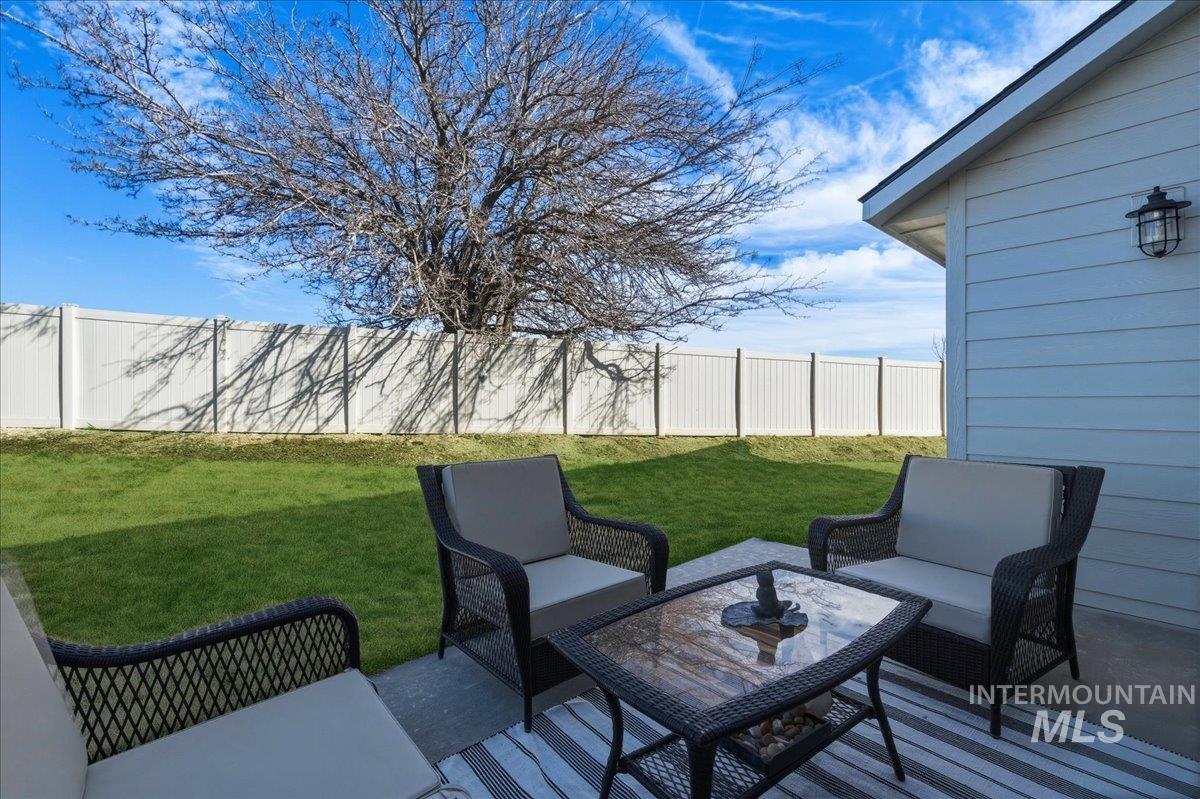 5392 South Memory Way Meridian, ID 83642 - Photo 31 of 39 Fenced backyard with a patio area and an outdoor living space