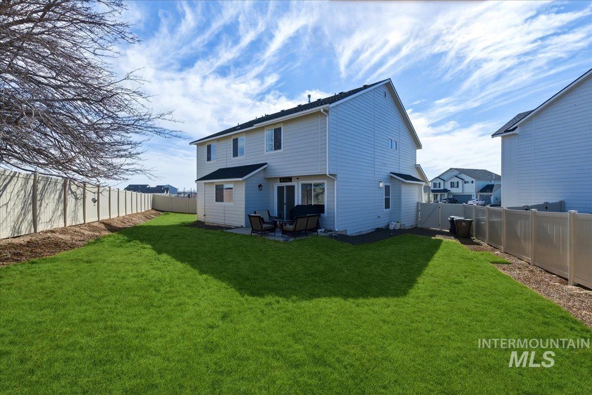 5392 South Memory Way Meridian, ID 83642 - Photo 32 of 39 Back of property featuring a patio area and a fenced backyard