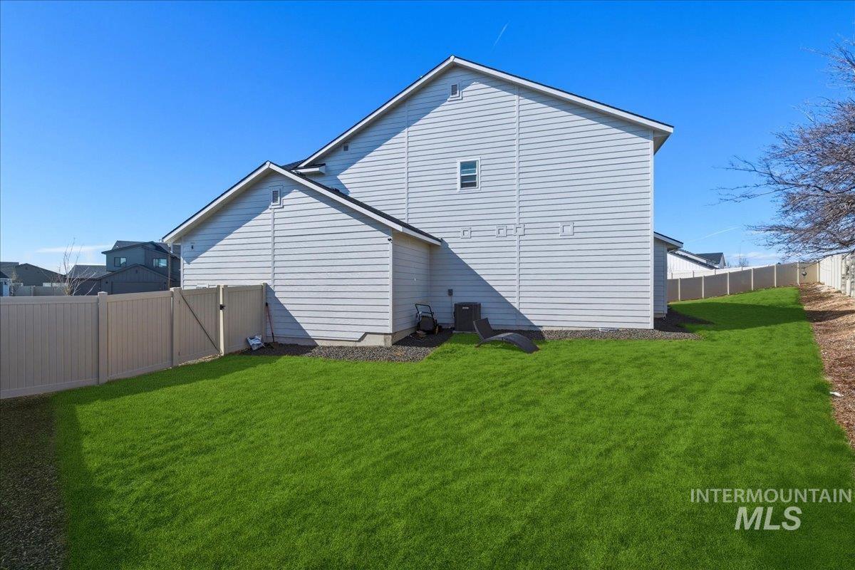 5392 South Memory Way Meridian, ID 83642 - Photo 34 of 39 Rear view of property featuring a fenced backyard