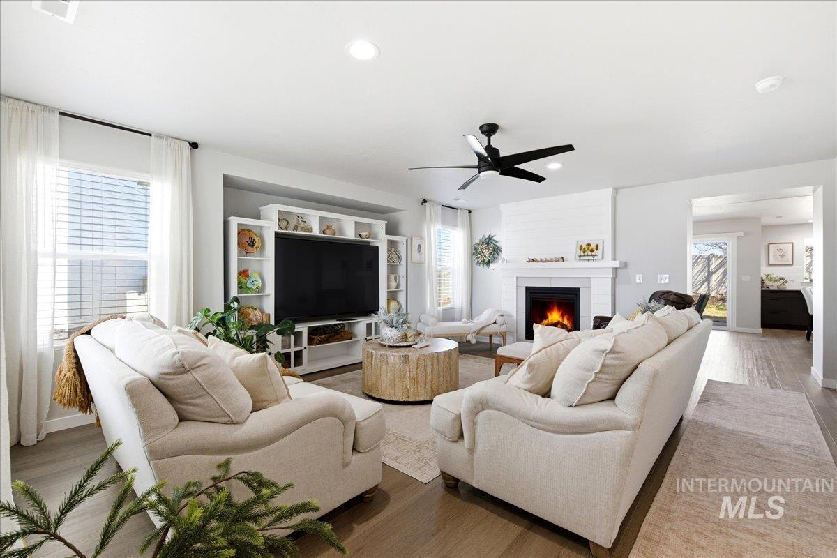 5392 South Memory Way Meridian, ID 83642 - Photo 6 of 39 Living area with ceiling fan, healthy amount of natural light, wood finished floors, and recessed lighting