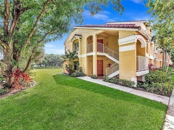 a view of a house with a yard