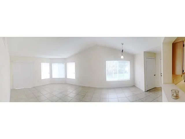 a black and white photo of a living room