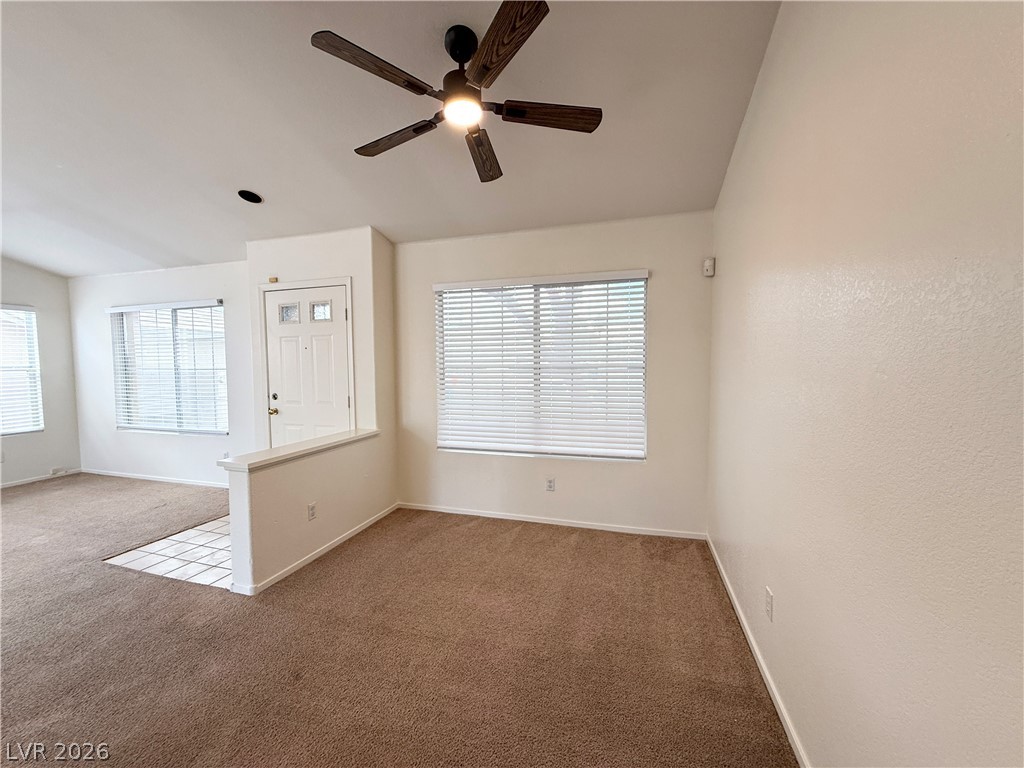 8870 Haviland Road Las Vegas, NV 89123 - Photo 4 of 24 A versatile living space with a classic entry door and broad windows for natural illumination.