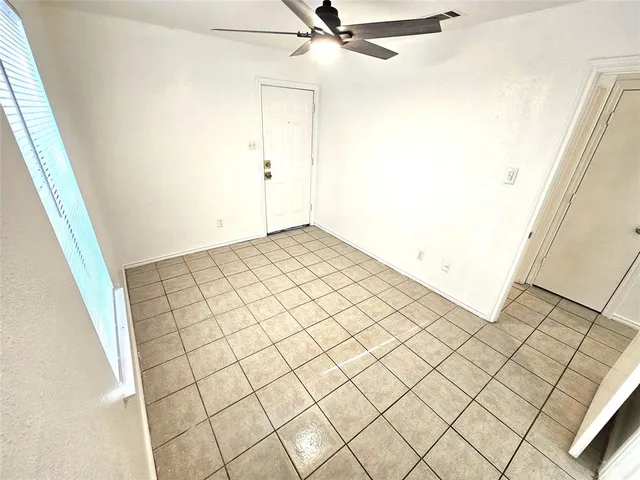 a view of a livingroom and window