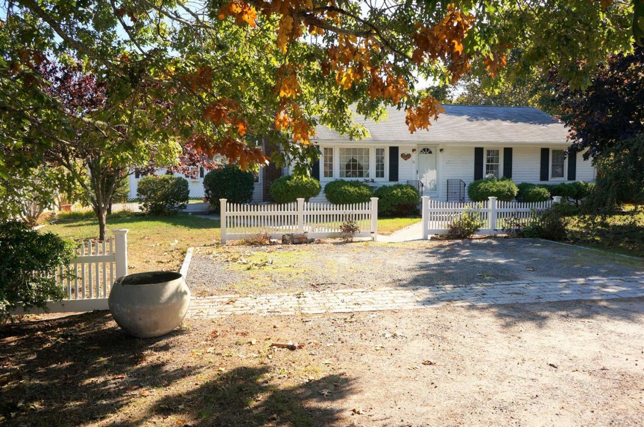 18 Edwards Road Dennis Port, MA 02639 - Photo 1 of 31 a view of a house with backyard and a tree