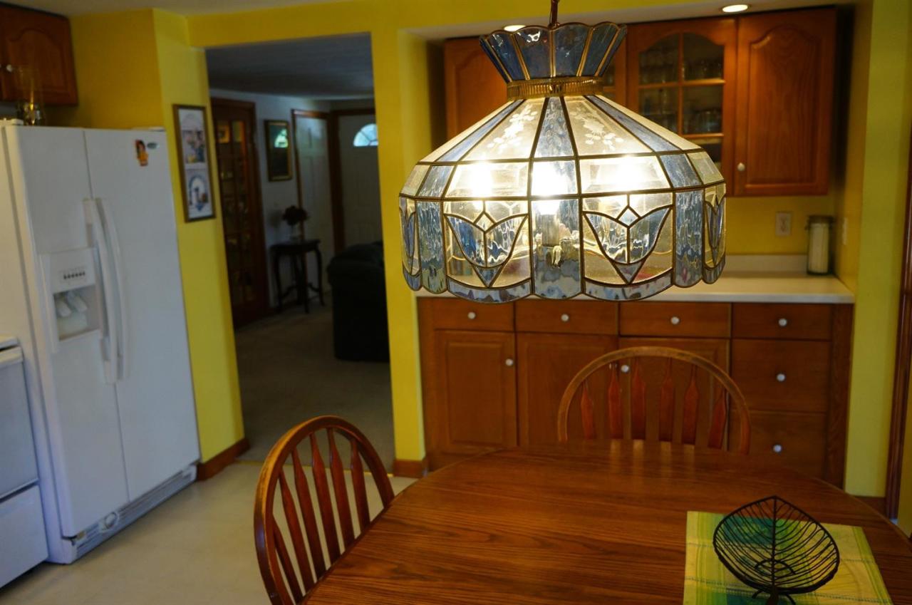 18 Edwards Road Dennis Port, MA 02639 - Photo 16 of 31 a bedroom with a bed and a chair
