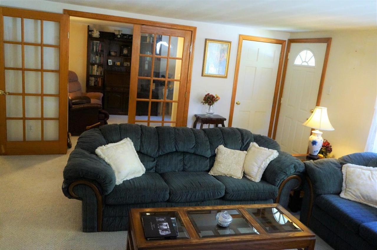 18 Edwards Road Dennis Port, MA 02639 - Photo 19 of 31 a living room with furniture and a lamp