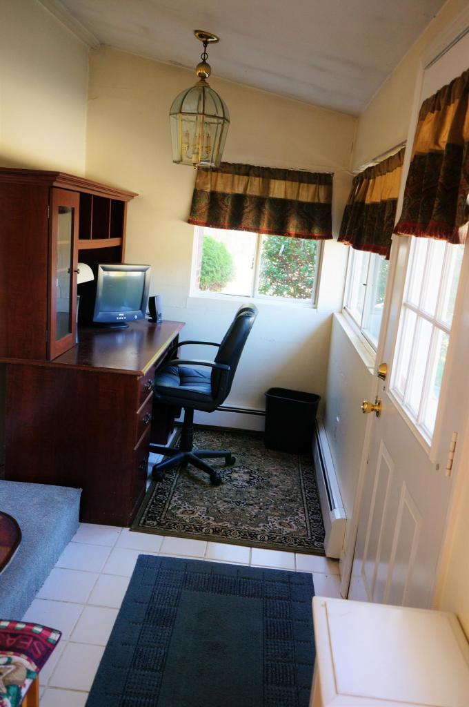 18 Edwards Road Dennis Port, MA 02639 - Photo 29 of 31 a living room with a couch and a table