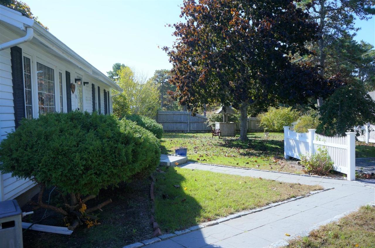 18 Edwards Road Dennis Port, MA 02639 - Photo 3 of 31 a view of a house with backyard and sitting area