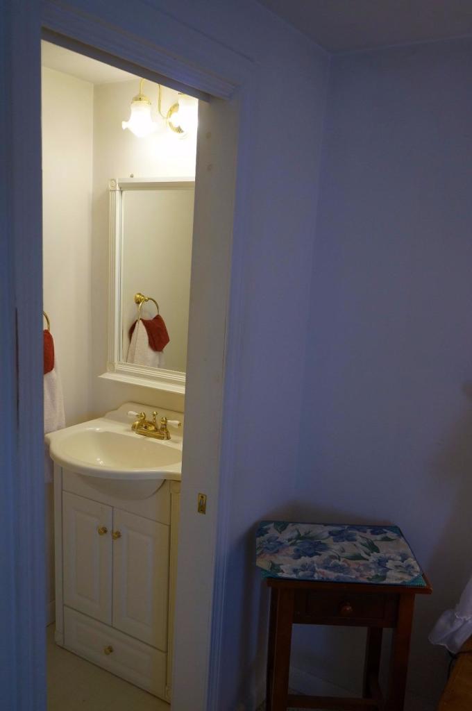 18 Edwards Road Dennis Port, MA 02639 - Photo 31 of 31 a bathroom with a sink toilet and vanity