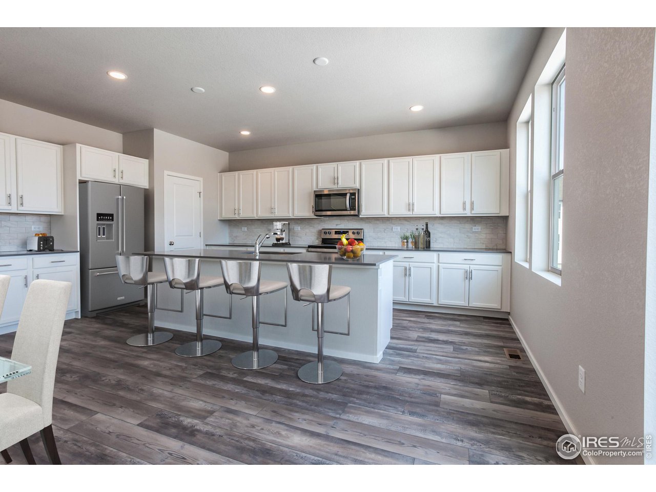 6638 4th St Road Greeley, CO 80634 - Photo 7 of 24 EXAMPLE PHOTO: KITCHEN WITH CENTER ISLAND