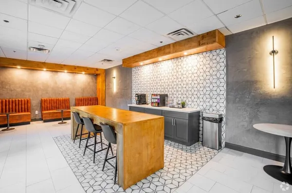 a kitchen that has a sink and a table in it