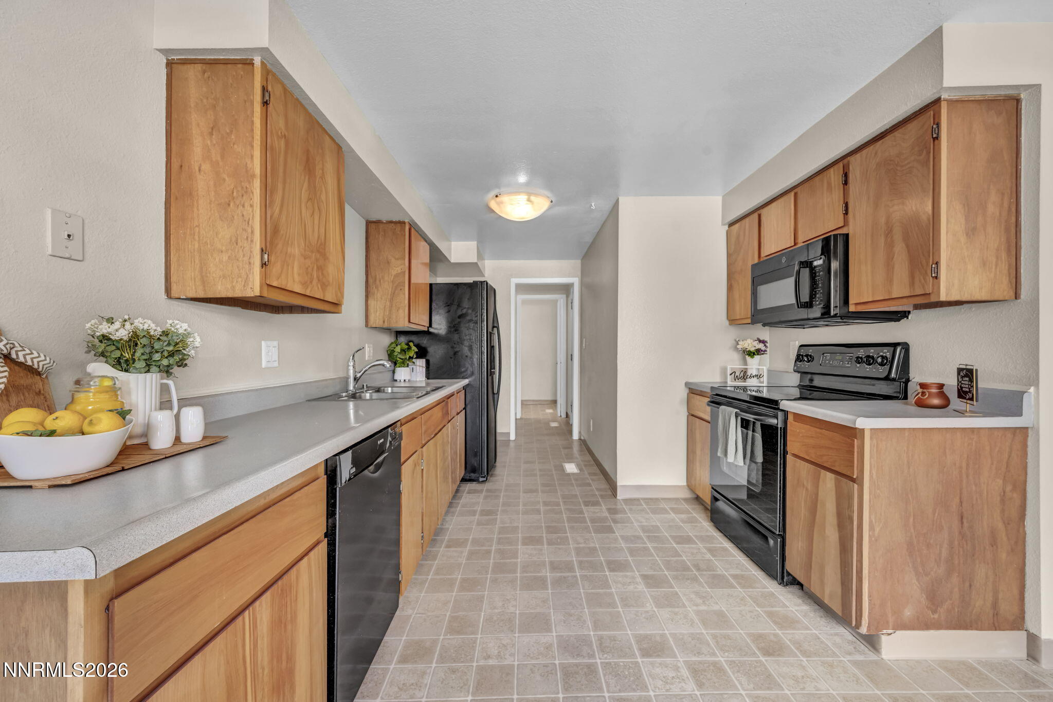 19 Condor Circle Carson City, NV 89701 - Photo 7 of 41 a kitchen with stainless steel appliances granite countertop a stove a sink dishwasher and a refrigerator