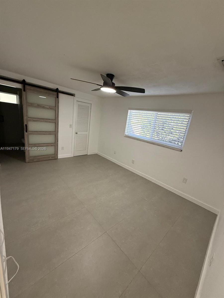 6891 Scott Street Hollywood, FL 33024 - Photo 16 of 28 an empty room with windows