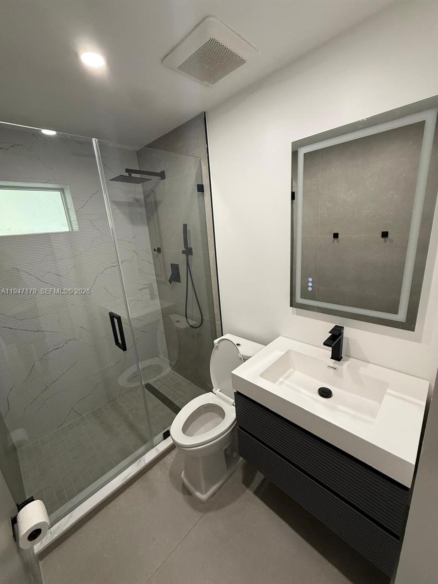 6891 Scott Street Hollywood, FL 33024 - Photo 20 of 28 a bathroom with a sink a toilet and shower