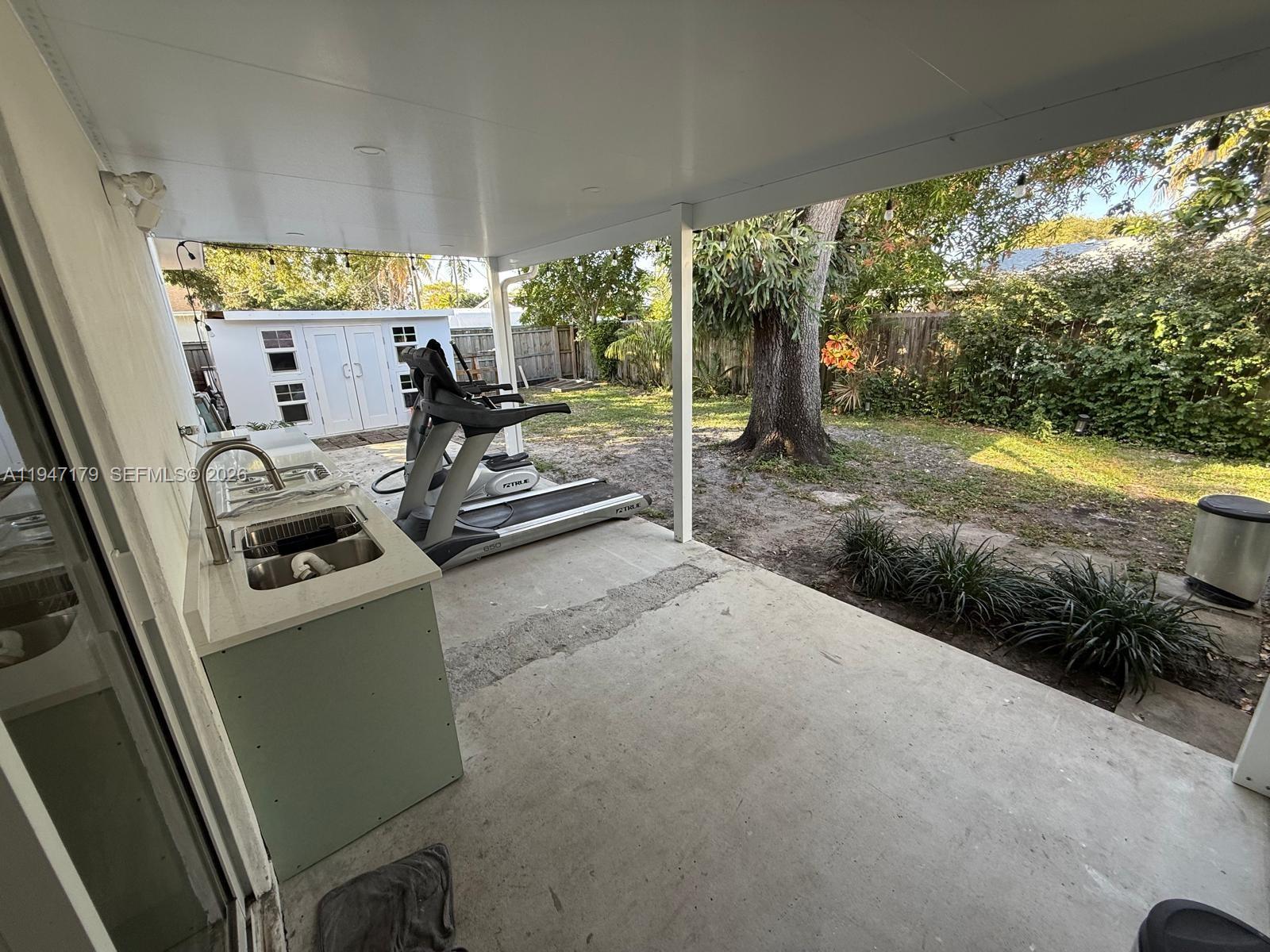 6891 Scott Street Hollywood, FL 33024 - Photo 22 of 28 a view of a room with gym equipment