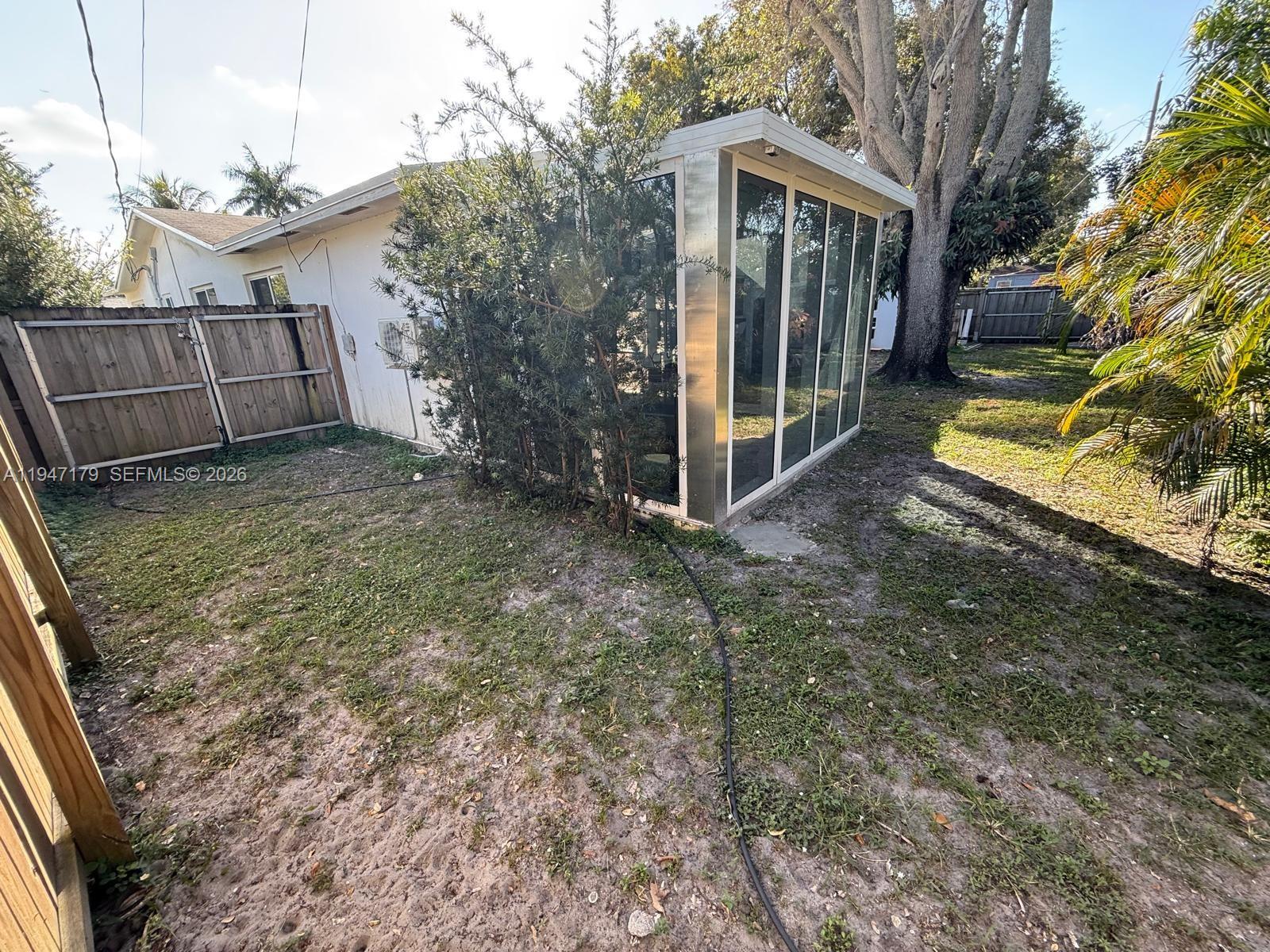 6891 Scott Street Hollywood, FL 33024 - Photo 27 of 28 a view of a house with a yard