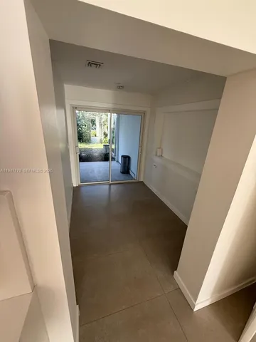 a view of a living room with a fireplace