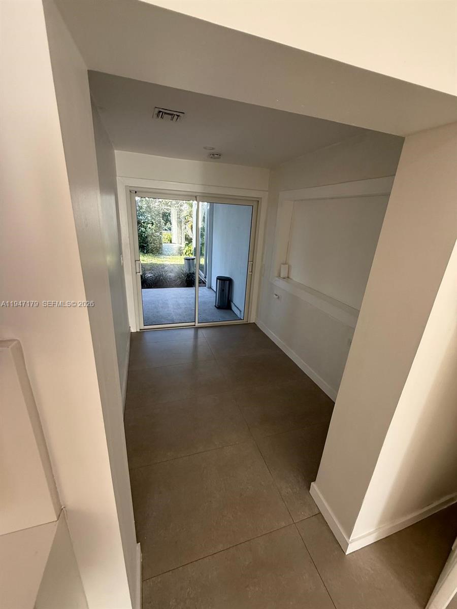 6891 Scott Street Hollywood, FL 33024 - Photo 8 of 28 a view of a living room with a fireplace