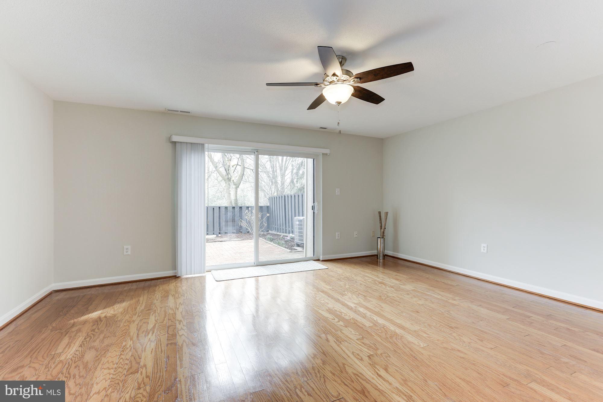 1383 Northgate Square Reston, VA 20190 - Photo 16 of 30 LARGE LIVING ROOM LOOKING OUT TO PRIVATE PATIO