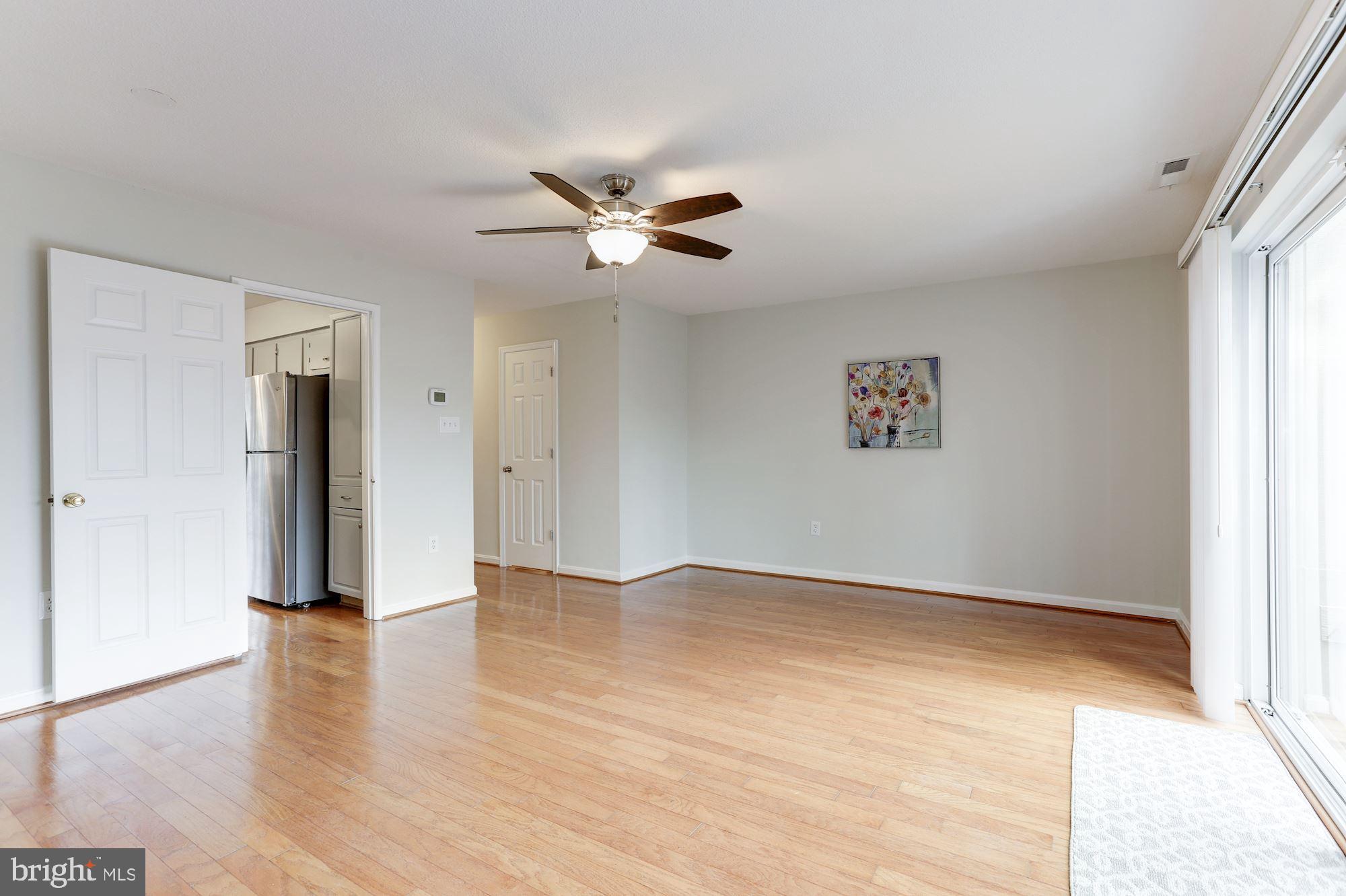 1383 Northgate Square Reston, VA 20190 - Photo 17 of 30 LIGHT AND BRIGHT LIVING ROOM W/CEILING LIGHT/FAN.