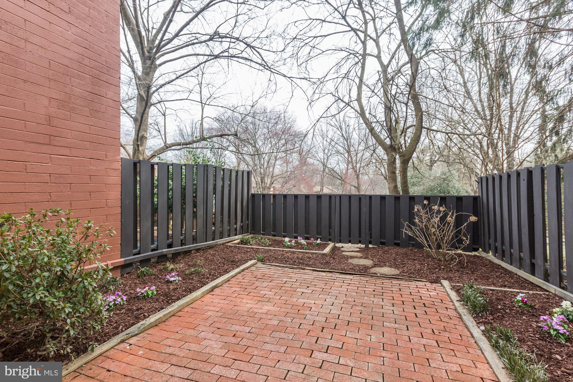 1383 Northgate Square Reston, VA 20190 - Photo 24 of 30 BRICKED PRIVATE COURTYARD BACKING TO COMMON AREA.