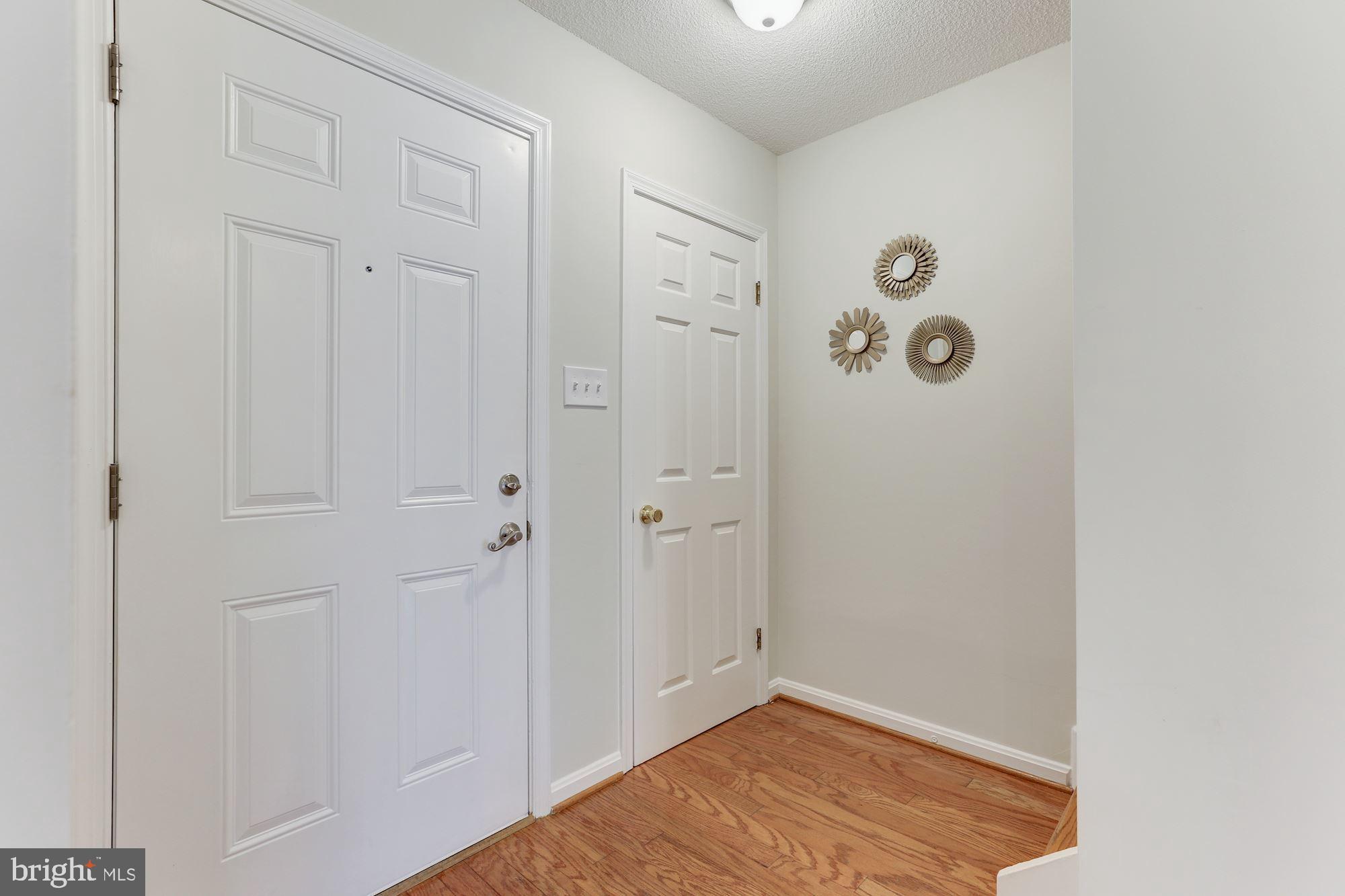 1383 Northgate Square Reston, VA 20190 - Photo 5 of 30 FOYER INCLUDES HARDWOOD FLOORING AND COAT CLOSET