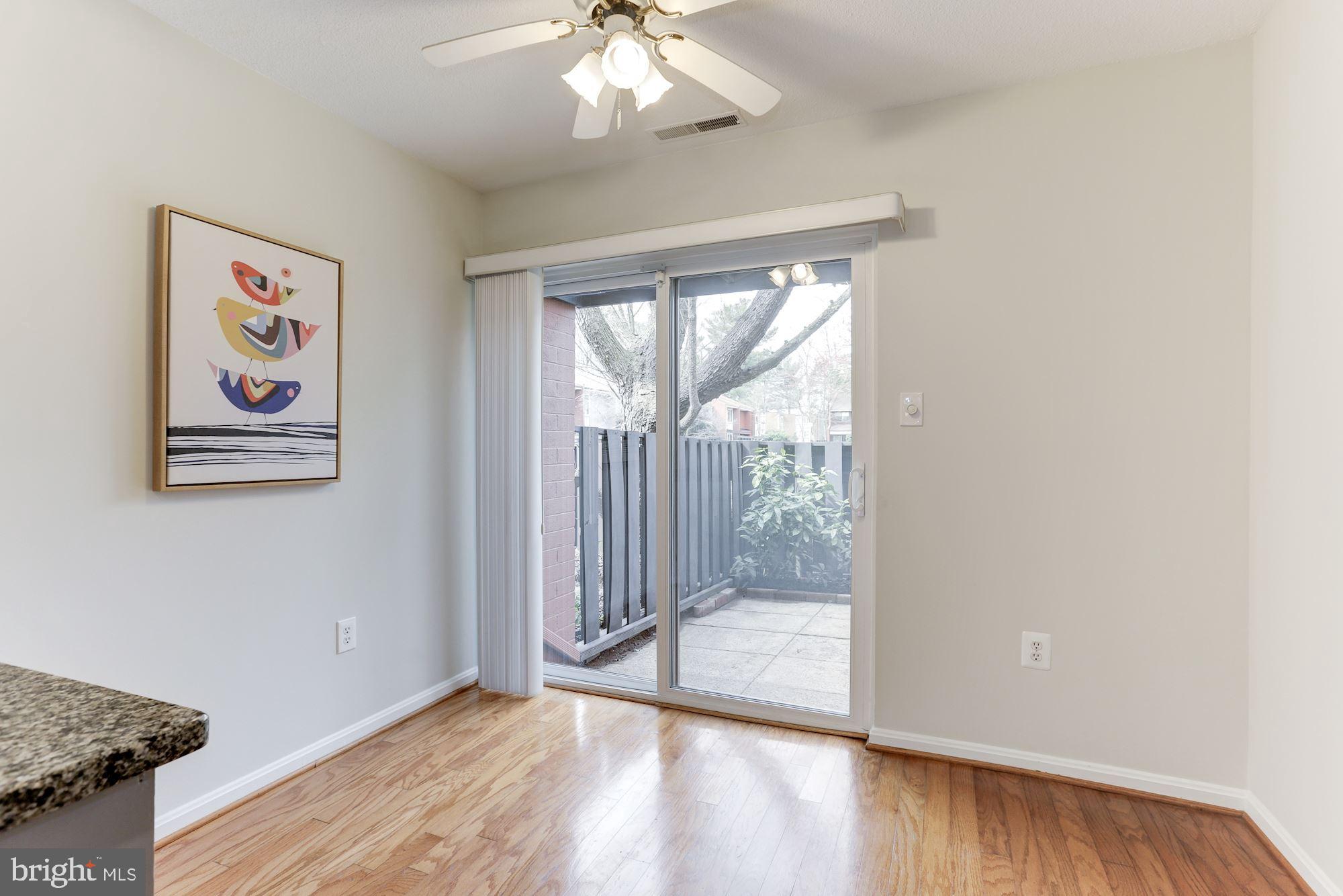 1383 Northgate Square Reston, VA 20190 - Photo 8 of 30 DINING AREA W/SLIDING GLASS DOOR TO FRONT PATIO!