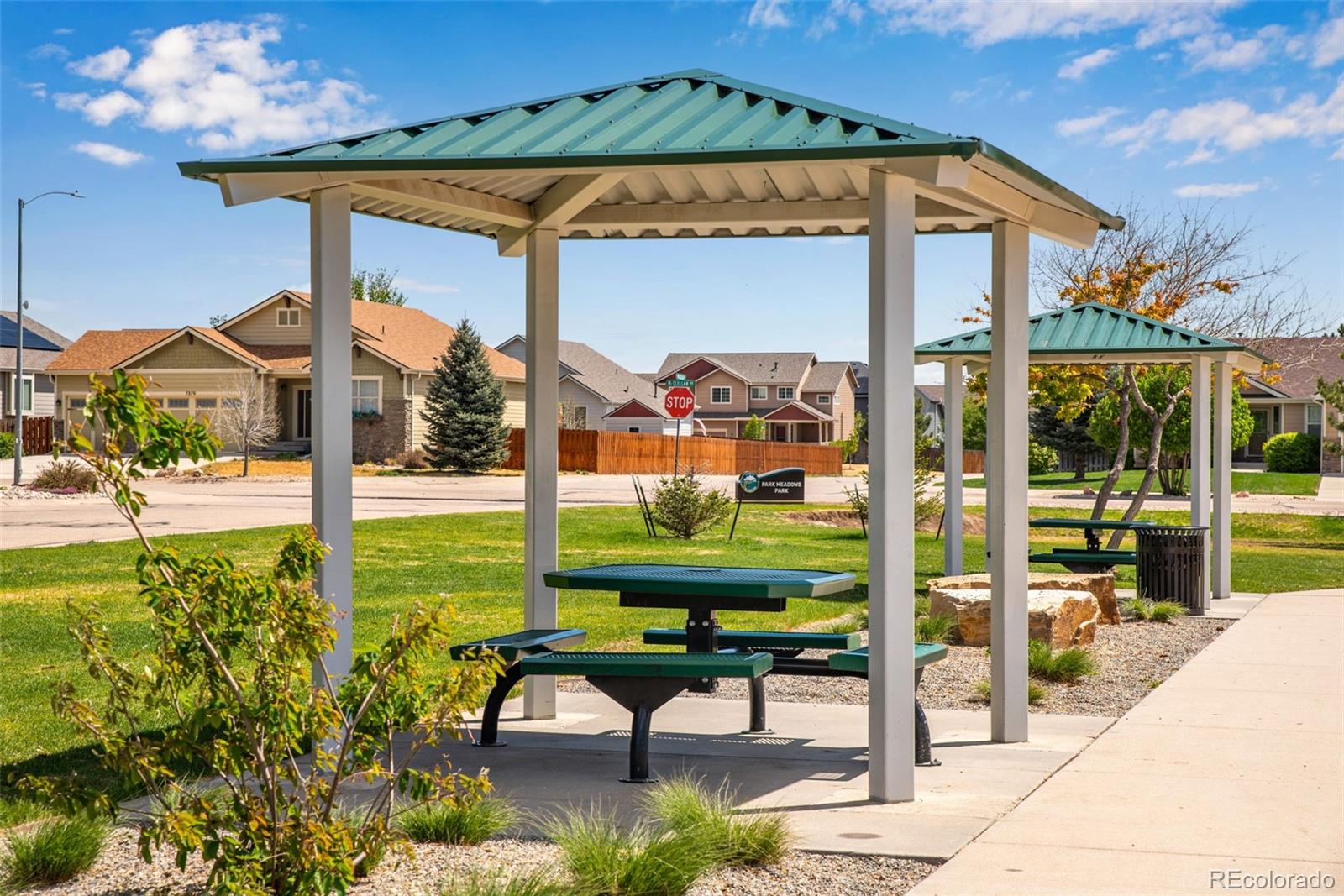 7035 McClellan Road Wellington, CO 80549 - Photo 39 of 43 a view of a patio with a table and chairs under an umbrella