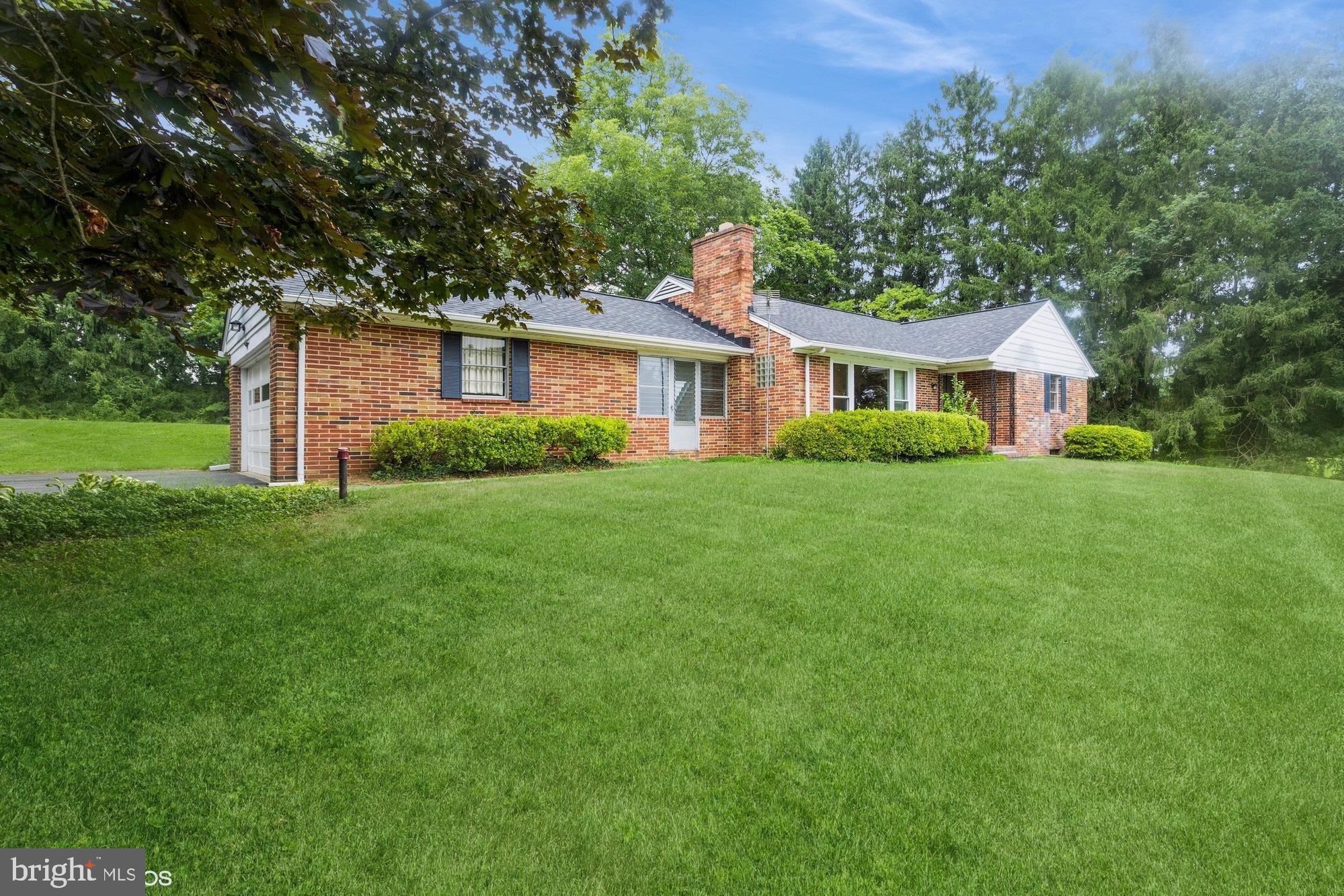 505 Whitaker Mill Road Fallston, MD 21047 - Photo 3 of 49 a front view of a house with a yard and trees