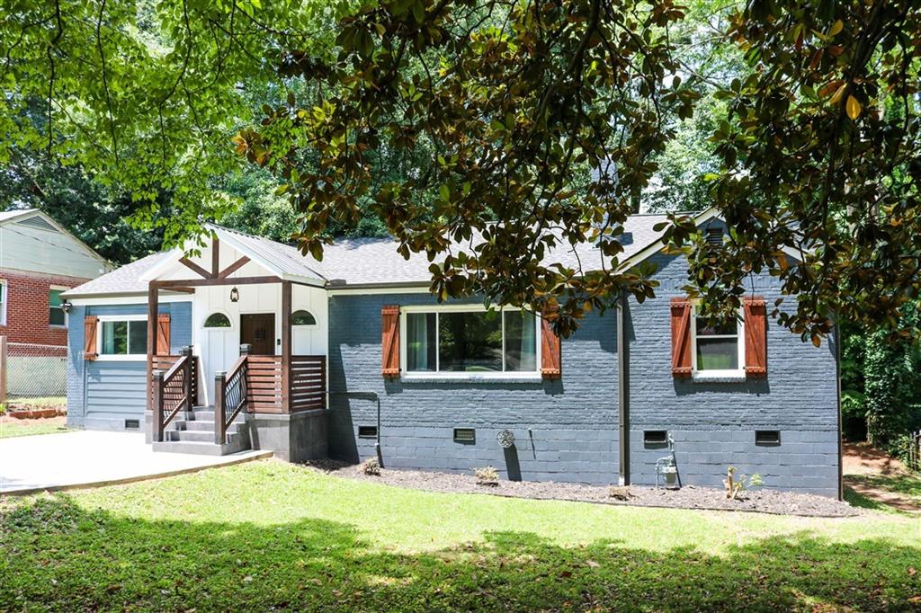 2348 Eastway Road Decatur, GA 30033 - Photo 1 of 1 a front view of a house with a yard
