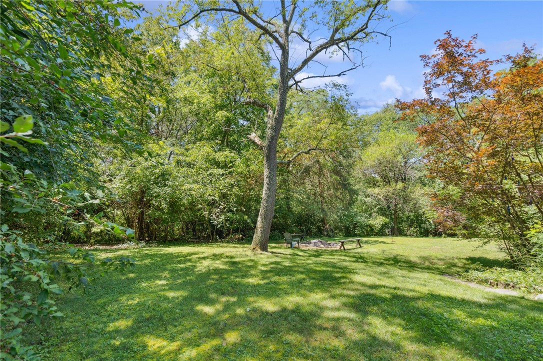 1940 Armstrong Road Fairborn, OH 45324 - Photo 39 of 48 This spacious yard offers ample room for outdoor recreation and relaxation amidst lush greenery.