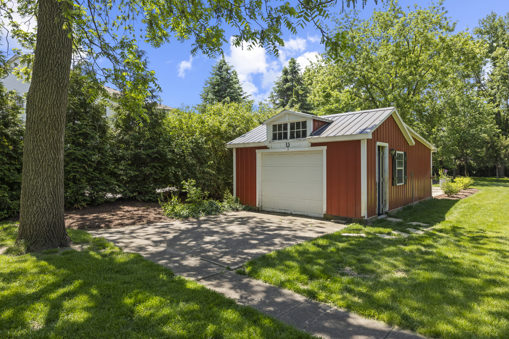 3614 Wolf Road Oswego, IL 60543 - Photo 47 of 56 a front view of a house with garden