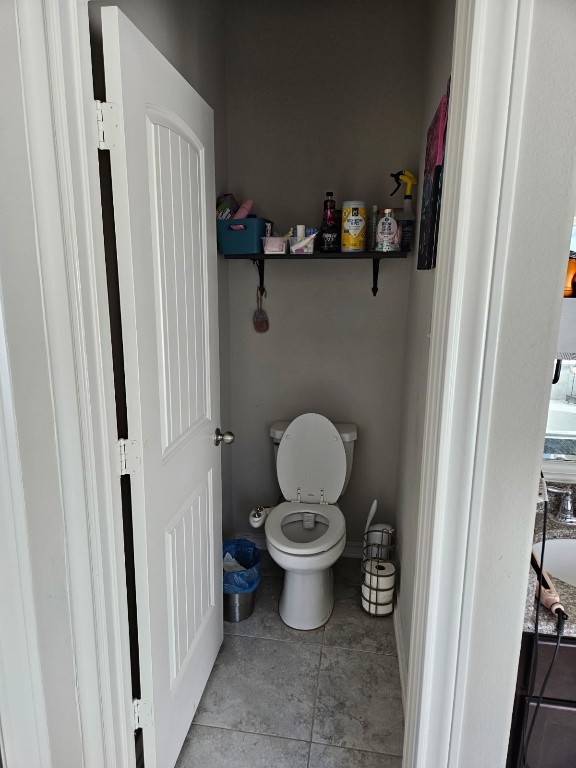 5710 Micah Lane Rosenberg, TX 77471 - Photo 15 of 36 Small half-bath with toilet and storage space.