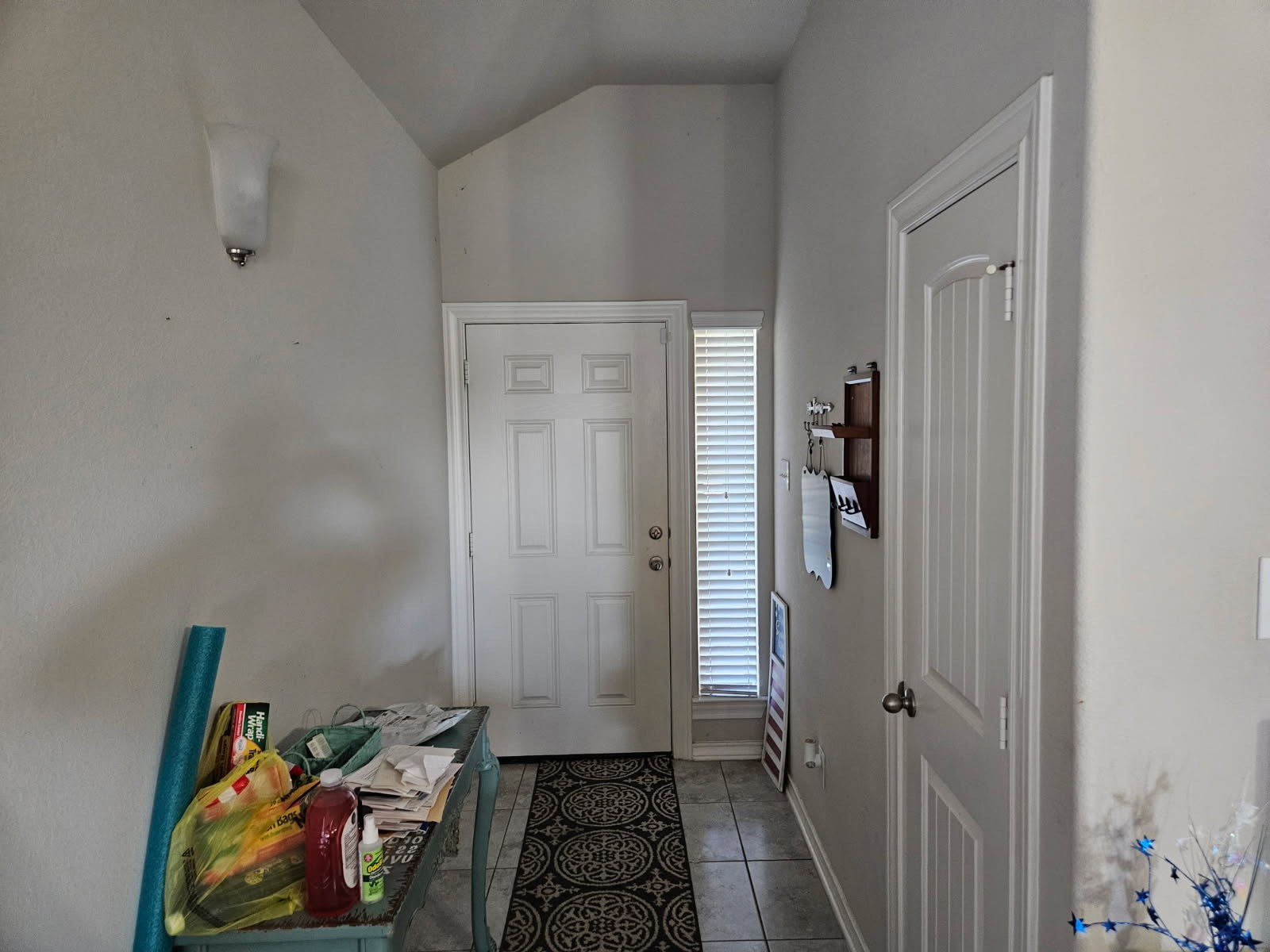 5710 Micah Lane Rosenberg, TX 77471 - Photo 22 of 36 Bright foyer entryway featuring high ceilings and neutral tile flooring that extends into the main living areas.