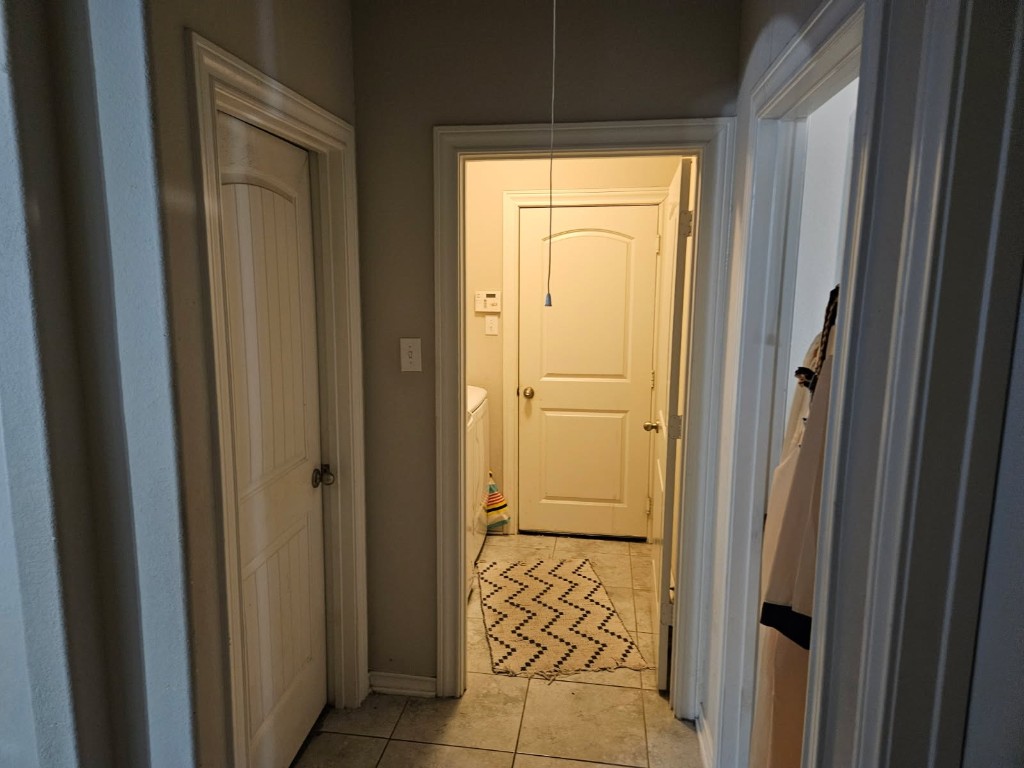 5710 Micah Lane Rosenberg, TX 77471 - Photo 24 of 36 Central hallway with neutral paint and clean lines, providing a smooth transition between rooms.