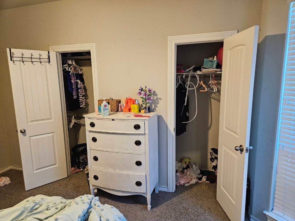 5710 Micah Lane Rosenberg, TX 77471 - Photo 25 of 36 Second bedroom featuring dual closets for excellent storage and large windows for a bright feel.