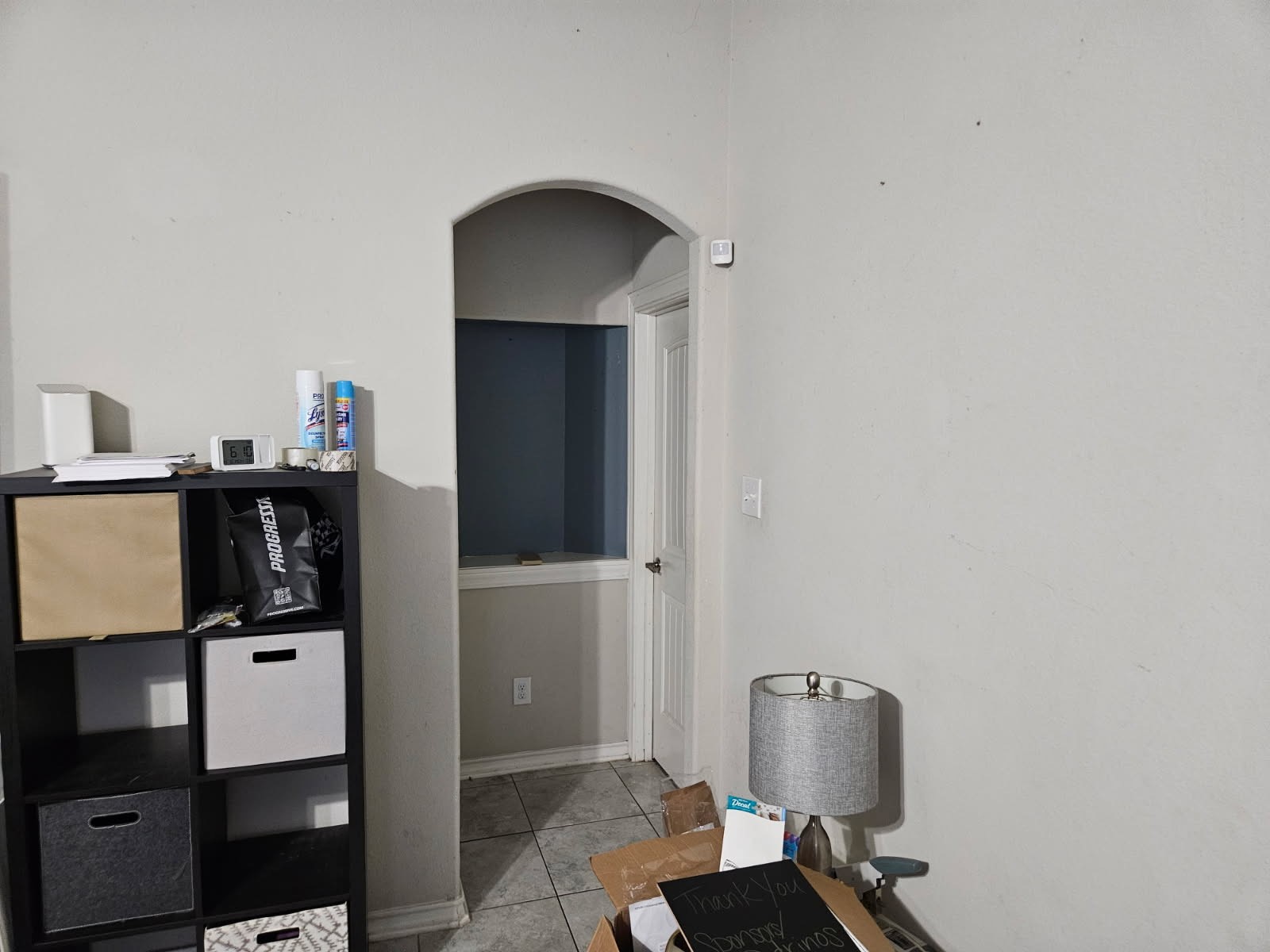 5710 Micah Lane Rosenberg, TX 77471 - Photo 26 of 36 Bedroom detail showing an elegant arched doorway leading to an attached walk-in closet or ensuite.