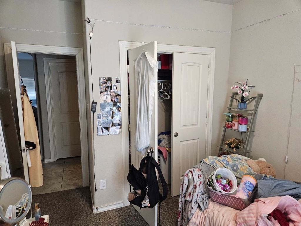 5710 Micah Lane Rosenberg, TX 77471 - Photo 27 of 36 View of the bedroom storage, highlighting a deep closet with built-in shelving.