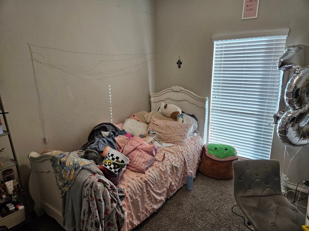 5710 Micah Lane Rosenberg, TX 77471 - Photo 28 of 36 Cozy third bedroom with large windows, perfect for a nursery, guest room, or home office.