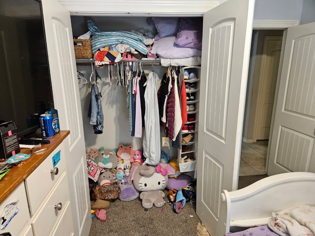 5710 Micah Lane Rosenberg, TX 77471 - Photo 31 of 36 Interior closet detail showcasing the generous storage capacity and organized shelving system.