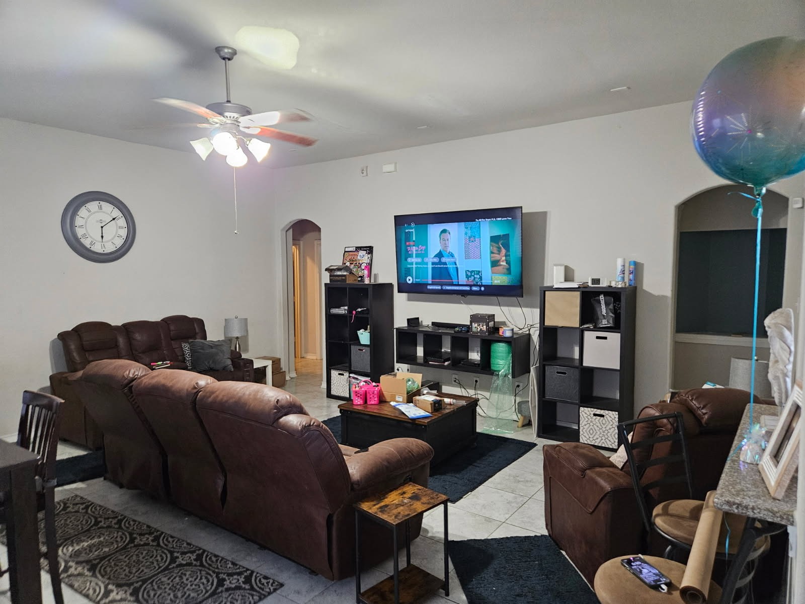 5710 Micah Lane Rosenberg, TX 77471 - Photo 4 of 36 Inviting living room with neutral tones, a ceiling fan, and plenty of space for a full media center and sectional seating.