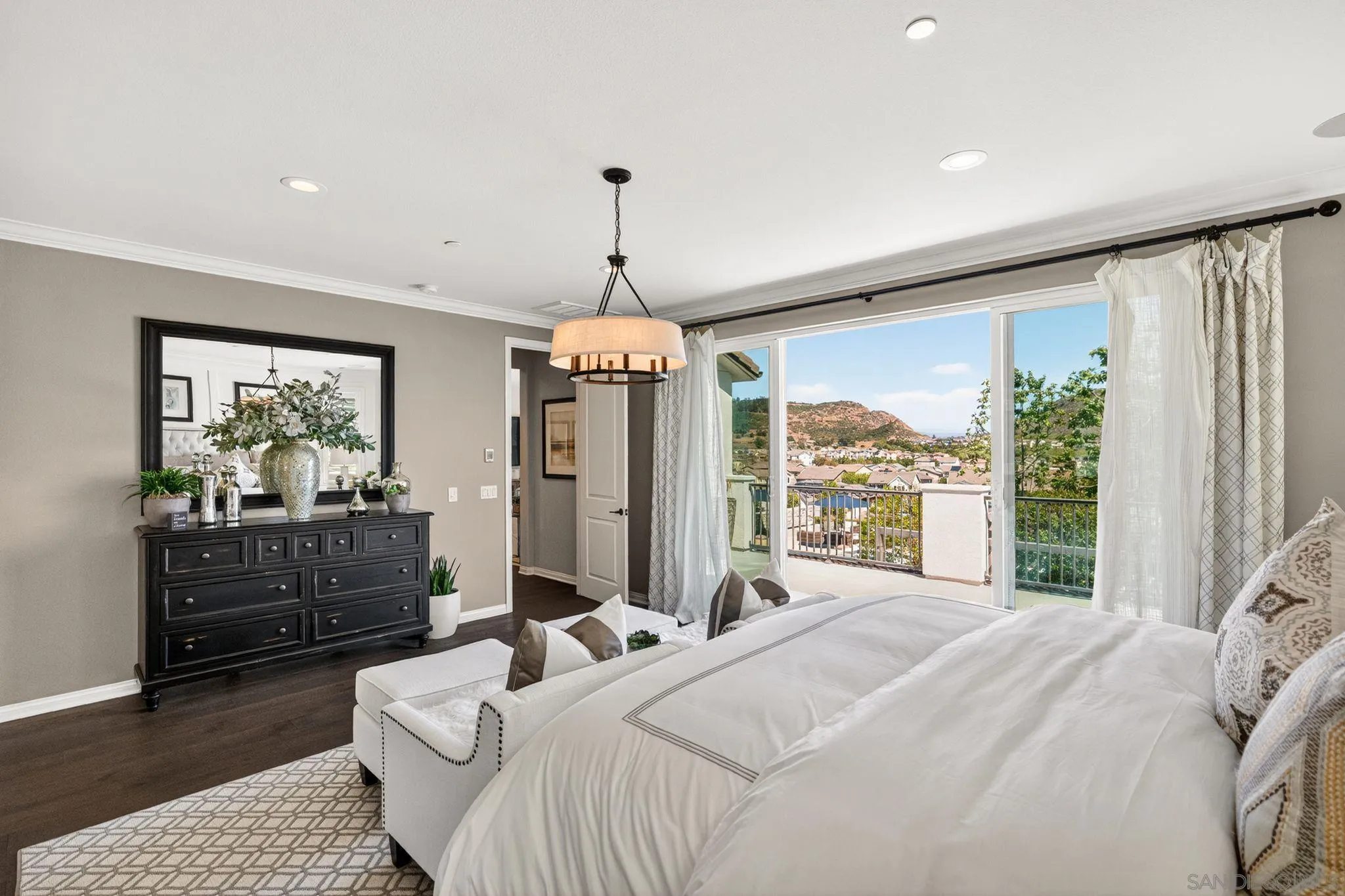 21509 Wilgen Road Escondido, CA 92029 - Photo 20 of 37 a bedroom with a bed chandelier and a window