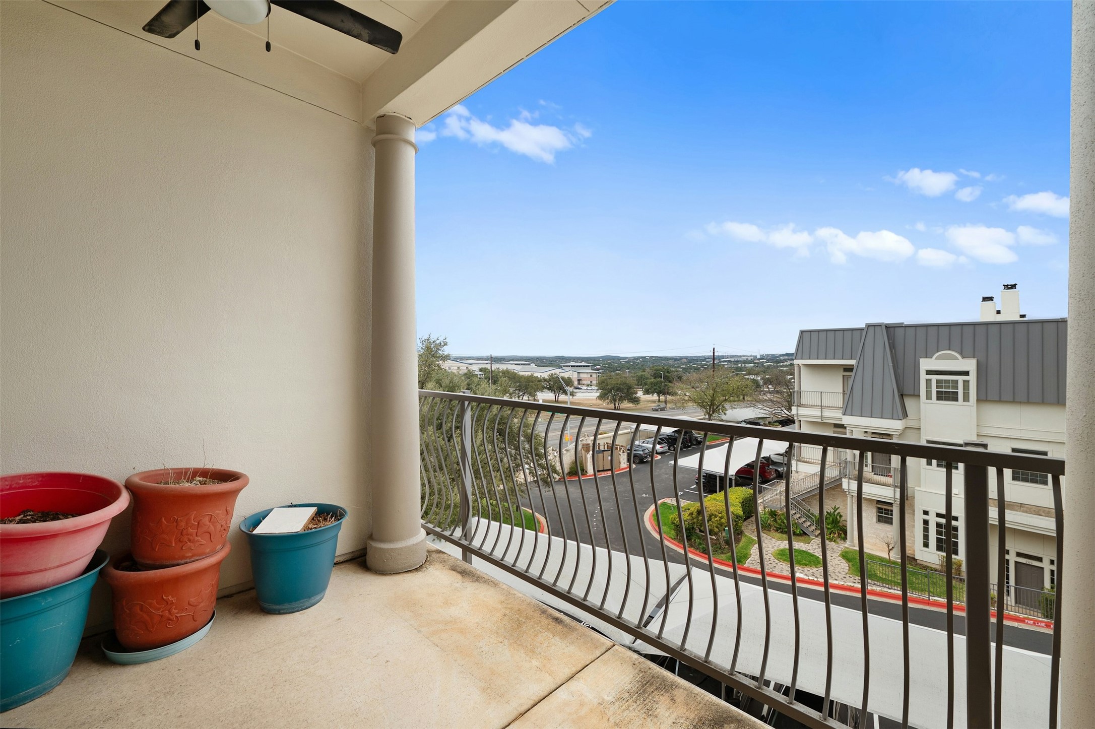 2918 Ranch To Market Road 620, Unit W219 Austin, TX 78734 - Photo 23 of 35 Wake up to peaceful Hill Country views and unwind on your private balcony just off the primary suite.