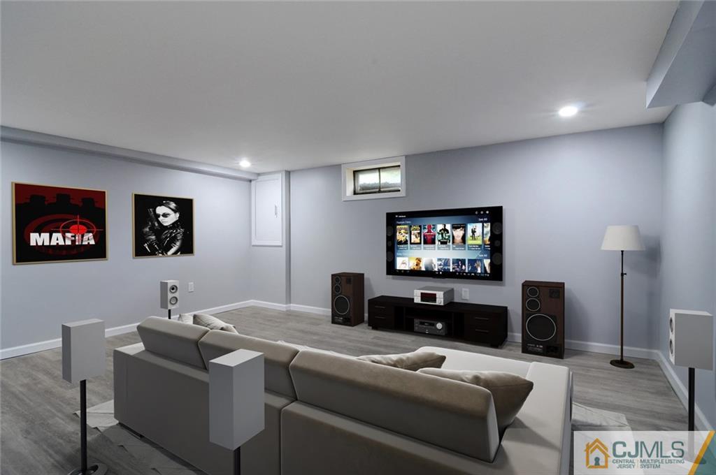87 West Hill Road Colonia, NJ 07067 - Photo 16 of 18 a living room with furniture and a flat screen tv