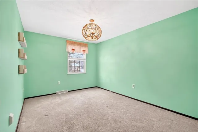 a view of a room that has a window in it